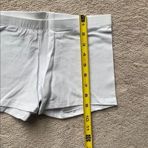 Stretchy white bike  shorts.